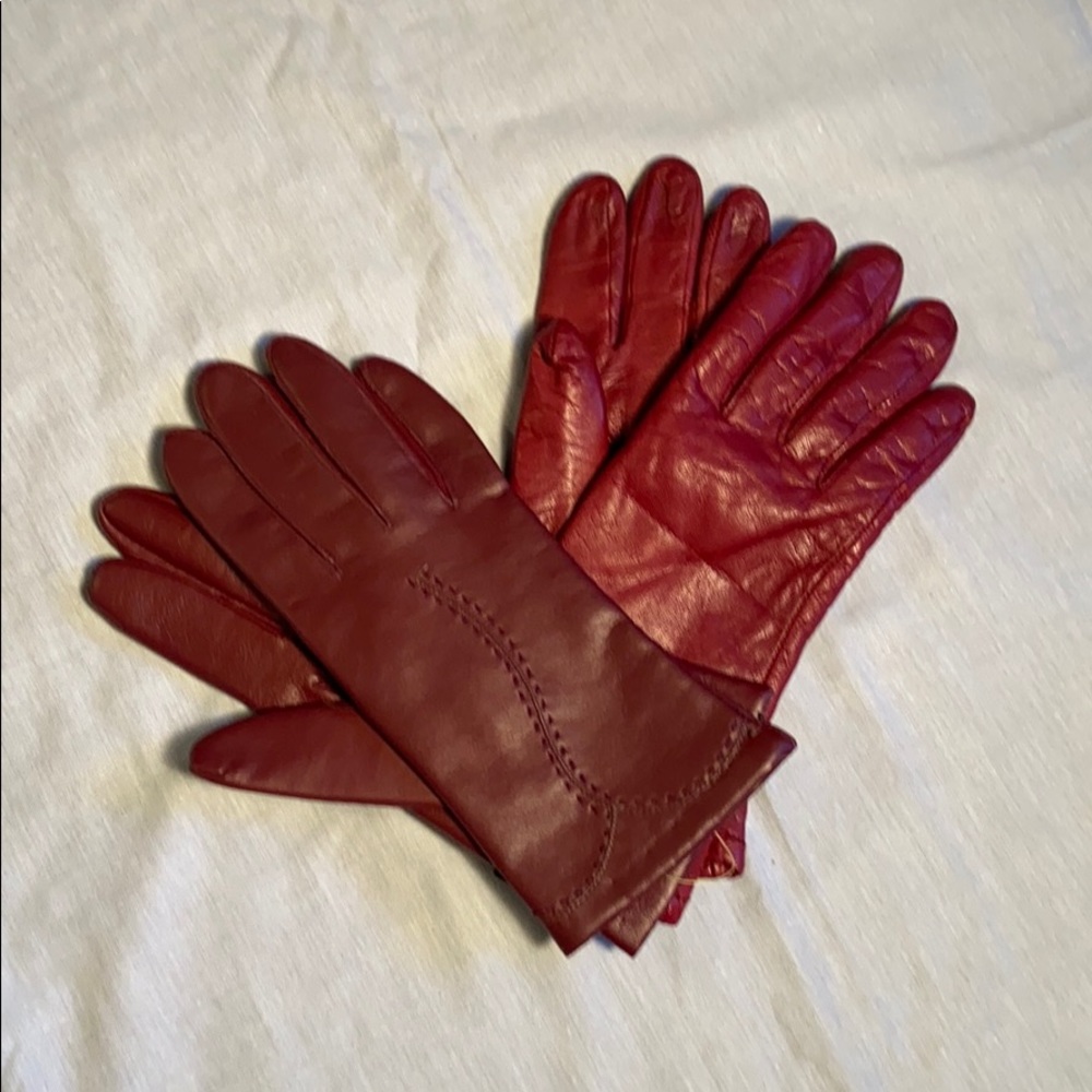 Two pairs a red faux leather gloves